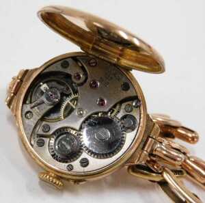 A mid-20thC wristwatch, the gold cased enamel watch head with a numbered border and blue hands,... - 3