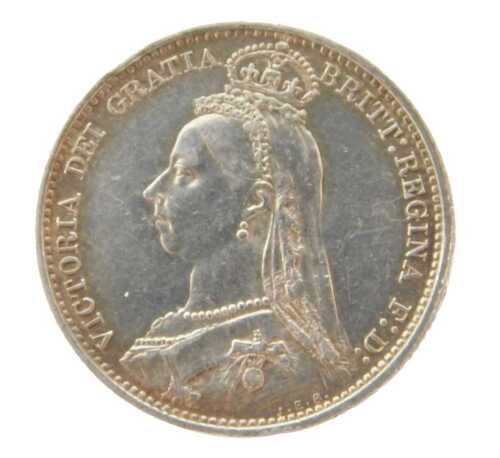A Queen Victoria silver coin 1887, shield back, in outer capsule.