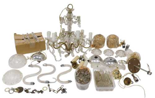 A 20thC cut glass six branch chandelier, the central glazed section with gilt metal mounts and...