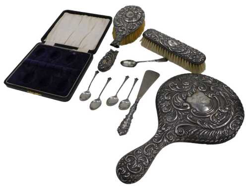 Various scrap silver and effects, a part dressing table set, heavily repousse decorated to...