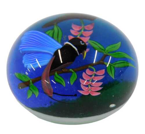 A Baccarat limited edition hummingbird paperweight, predominantly in pink, green and blue,...