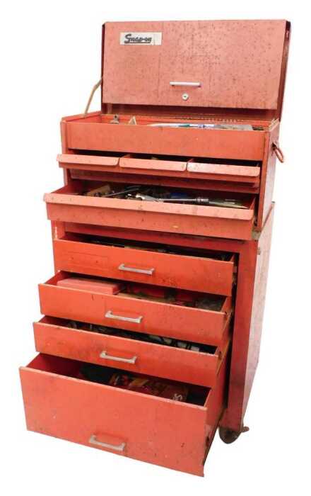 A Snap-On tool cabinet, the upper section with front hinged opening section above three long...