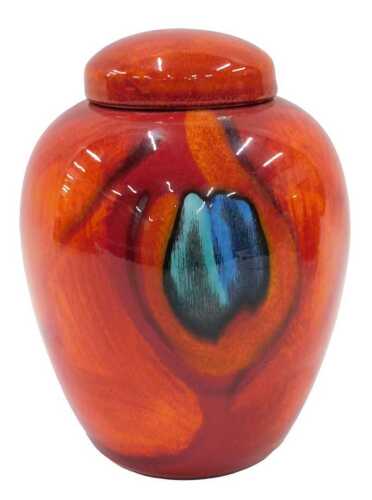 A 20thC Poole pottery Delphis type Volcano peacock pattern jar and cover, of tapering circular...