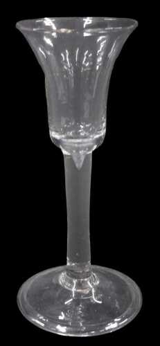 An English ale glass, with bell shaped bowl, on plain stem and conical foot, probably 18thC,...