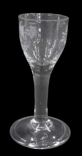 An etched cordial glass, with egg shaped bowl, etched with flowers, on plain stem and conical...