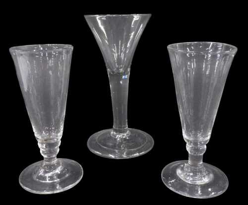 An English ale glass, with bell shaped bowl, on plain cylindrical tapering stem, on conical foot,...