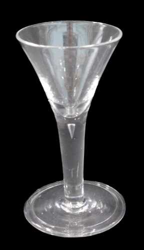 An English ale glass, with bell shaped bowl, on teardrop stem and plain foot, probably 18thC,...