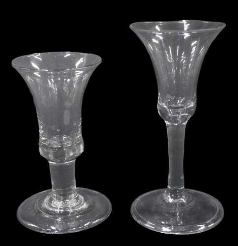 An English ale glass, with plain bell shaped bowl, on plain stem and circular foot, 16cm high,...
