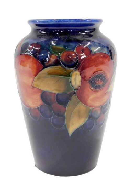 A Moorcroft pottery Pomegranate pattern vase, of shouldered form, on blue ground, 17cm high.