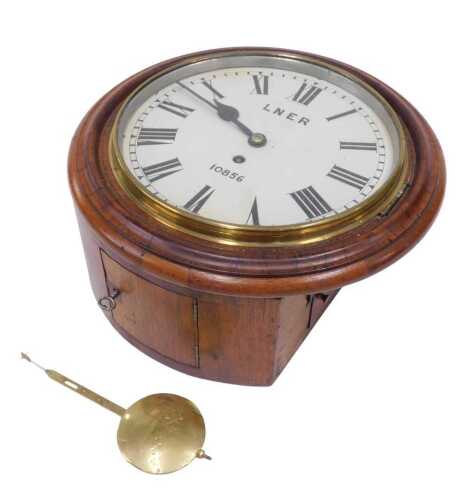 A late 19thC and early 20thC mahogany cased railway clock, the 24cm diameter Roman numeric dial...