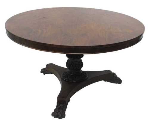 A late William IV mahogany and flame mahogany tilt top dining table, the circular top with a...