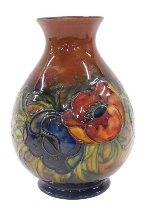 A Moorcroft pottery flambe Anemone pattern vase, of bulbous form with compressed stem on...