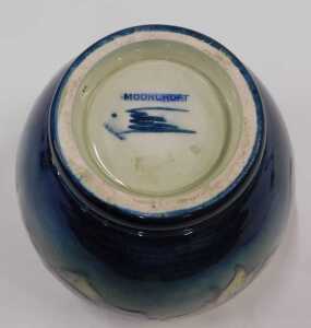 A Moorcroft pottery Clematis pattern vase, of compressed circular form on circular foot, on... - 2