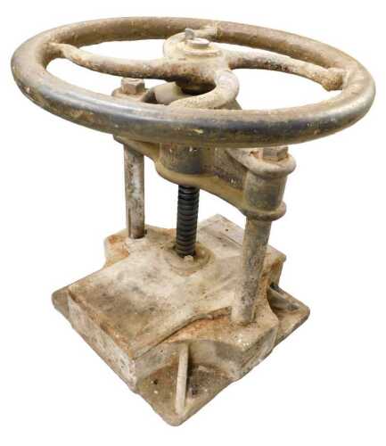 An early 20thC industrial iron press, with label marked 220, with articulated circular...