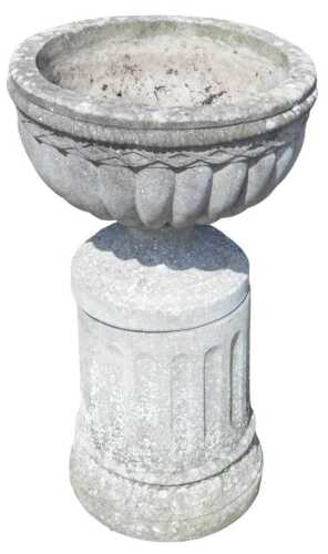 A 20thC classical design reconstituted stone planter, composed of a classical urn, on inverted...