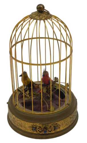 A 20thC Continental bird cage automaton, with two birds, partially feathered on a metal floral...