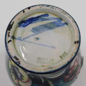 A Moorcroft pottery Multicoloured Poppy pattern vase, of bellied circular form, on green ground,... - 2