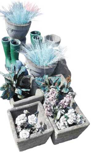 Various garden statuary, planters, etc., a reconstituted stone recumbent spaniel garden ornament,...