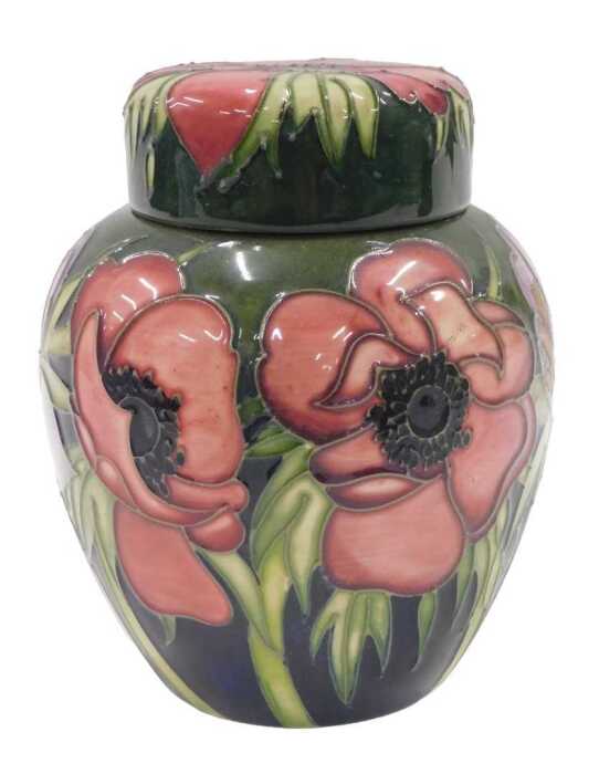 A Moorcroft pottery Anemone Tribute pattern ginger jar and cover, on green ground, 18cm high.