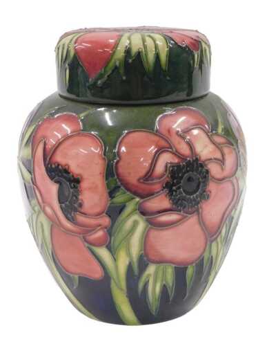 A Moorcroft pottery Anemone Tribute pattern ginger jar and cover, on green ground, 18cm high.