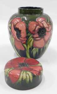 A Moorcroft pottery Anemone Tribute pattern ginger jar and cover, on green ground, 18cm high. - 2