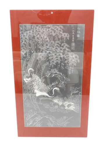 20thC School. Asian wall panel, crane and trees, bearing signature, on red glazed backing, 130cm...