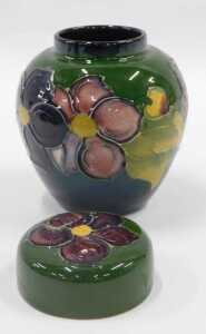 A Moorcroft pottery Clematis pattern miniature ginger jar and cover, on green ground, 12cm high. - 2