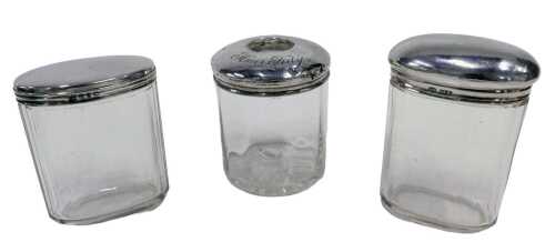 Various silver topped cut glass jars, an Edward VII silver hair pot, with circular lid marked...