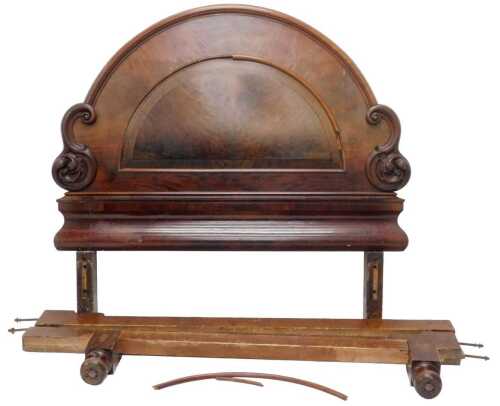 A Victorian flame mahogany double bed, the elaborate 160cm wide circular carved scroll headboard,...