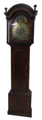 An early 19thC walnut longcase clock, with a part painted arched brass dial, with part moving...