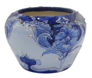 A Moorcroft pottery Florian ware Macintyre bowl, of compressed circular form, tube lined with...