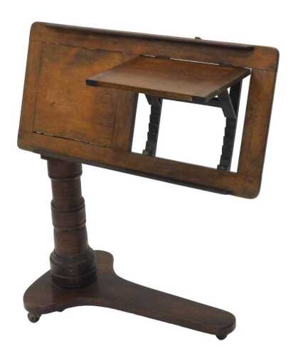 A 19thC Leveson and Sons mahogany reading table, with articulated top, raised on a heavy turned...