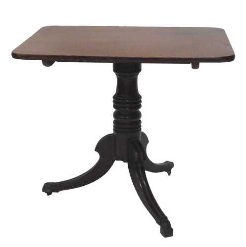 An early 19thC mahogany tilt top occasional table, the oblong top raised on a heavy turned stem...