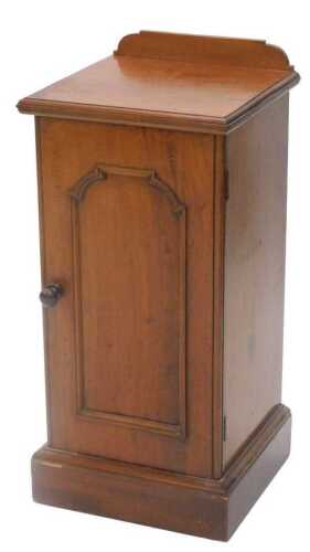 A Victorian mahogany pot cupboard, of square form, with fielded panelled door, on a block base,...