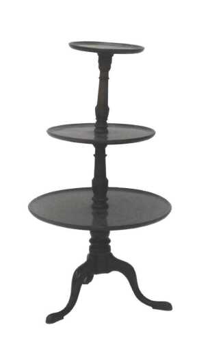 An early 19thC mahogany three sectional dumbwaiter, with circular sections broken by turned...