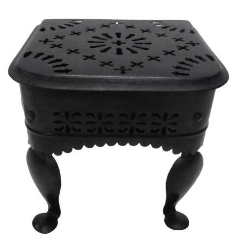 A Georgian style iron footman, the D end pierced top, raised on inverted legs terminating in...