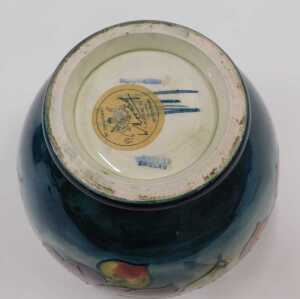 A Moorcroft pottery Clematis pattern bowl, of tapering circular form on circular foot, on green... - 2