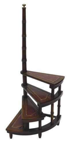 A 20thC mahogany library step, with turned bamboo style arm support with brass compressed orb...