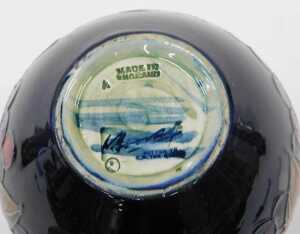 A Moorcroft pottery Pomegranate pattern vase, of compressed bellied circular form, on blue... - 2