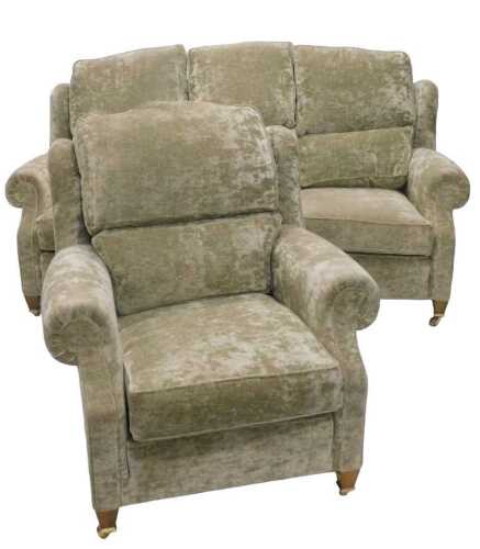 An Edwardian style two piece lounge suite, comprising a three seater lounge settee and armchair,...