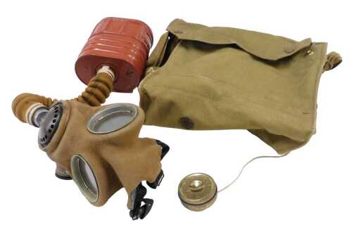 A mid 20thC British Army General Service respirator gas mask, in unused condition, in outer...