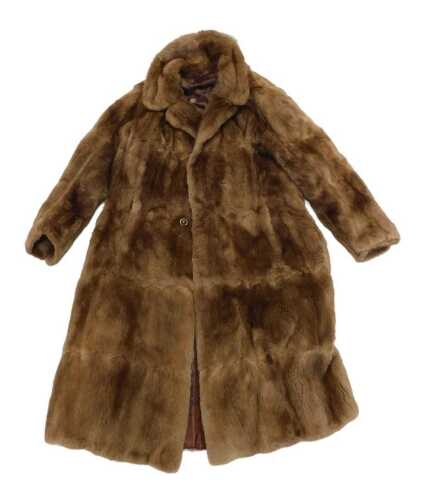 A vintage tan lady's fur coat, three quarter length, with Capstick and Hamer Bradford and...