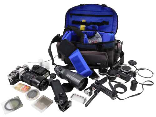 Various cameras and related items, an Olympus OM-2N camera, 9cm high, Vivitar 75-205mm 1:3.8...