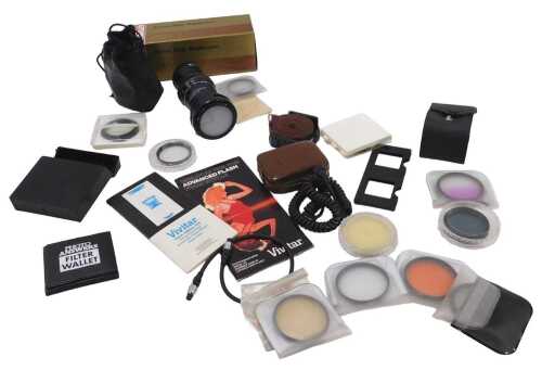 Various camera accessories, a Clubman zoom slide duplicator, in outer packaging, light meter,...