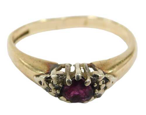 A 9ct gold garnet and diamond dress ring, the garnet fancy cut as a heart, set in white gold, on...