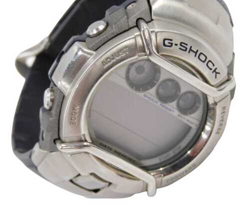 A Casio G Shock gent's wristwatch, marked G-3110, in stainless steel case, on a blue material...