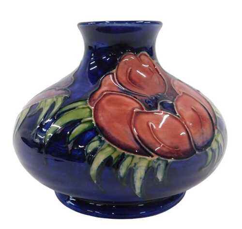 A Moorcroft pottery Anemone pattern squat vase, of bellied circular form on circular foot, on...