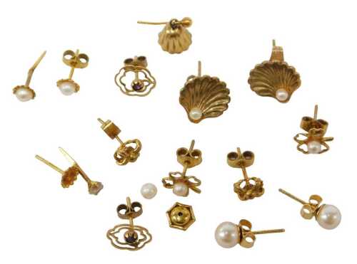 A group of 9ct gold and other stud earrings, comprising a pair of 9ct gold shell capped earrings,...