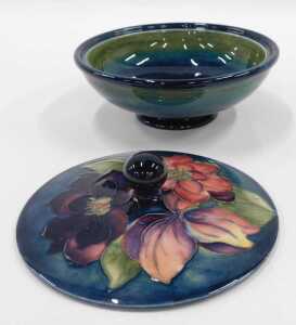 A Moorcroft pottery Clematis pattern jar and cover, of compressed circular form, 16cm wide. - 2