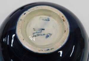 A Moorcroft pottery Clematis pattern jar and cover, of compressed circular form, 16cm wide. - 3